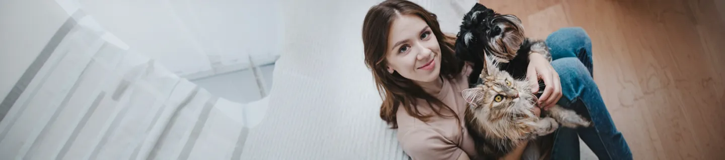 Woman smiling with a cat